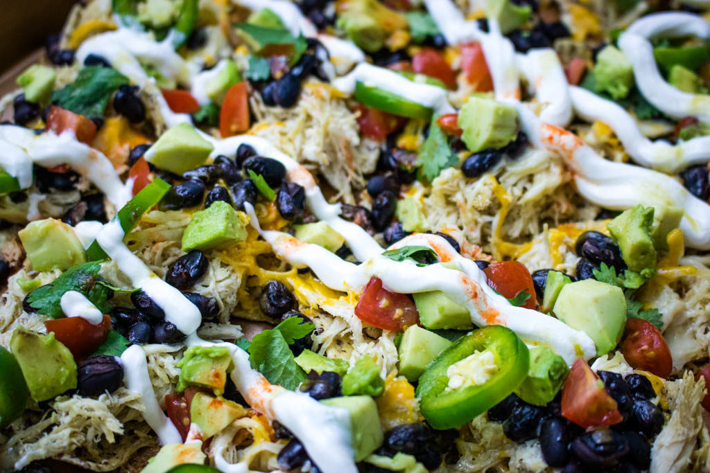 Close up of Sheet Pan Loaded Chicken Nachos toppings