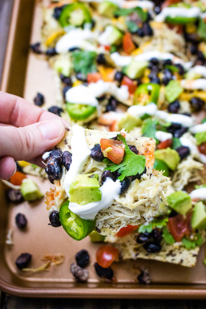 Sheet Pan Loaded Chicken Nachos single nacho with toppings