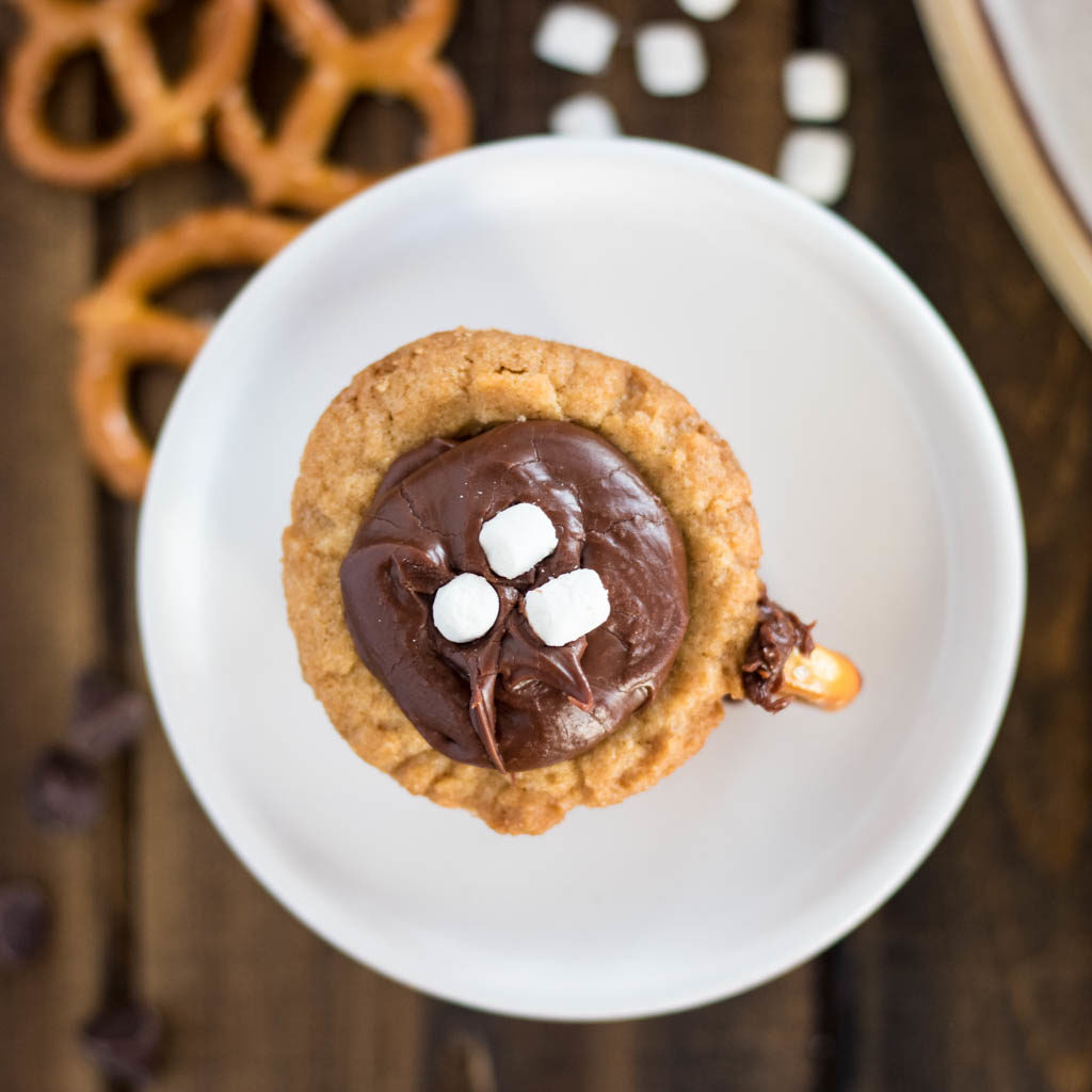 top view hot chocolate cookie cup with pretzels and miniature marshmallows