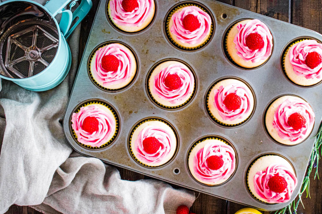 Top view cupcakes with frosting in muffin tin